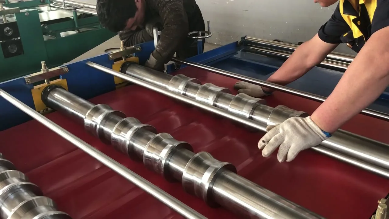 Trapezoidal Roof Sheet Machine — Operator Hand-Feeding the Profile | ZTRFM